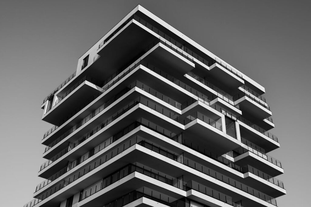 pexels-photo-157811 A striking black and white photo of a modern high-rise building with unique geometric designs.